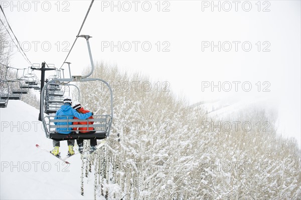 Skiers on a ski lift