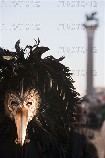 A person wearing a mask in in St. Mark's Square