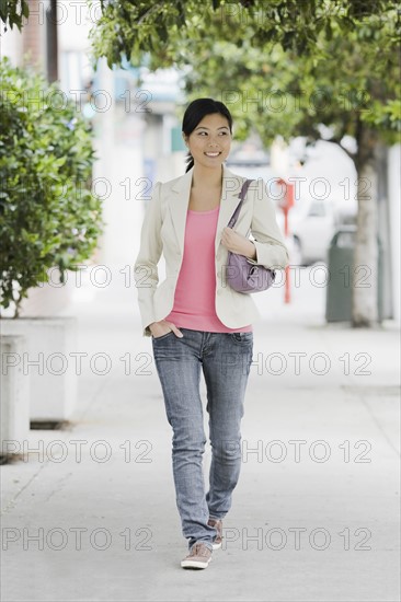 A woman walking down the street