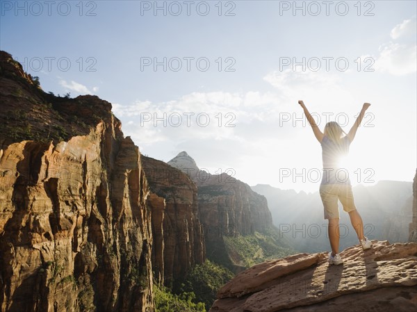 A woman standing at an apex at Red Rock