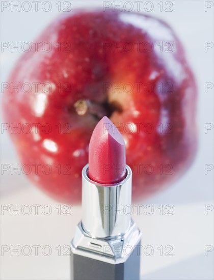 Lipstick and a red apple