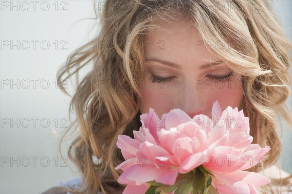 A woman holding flowers.