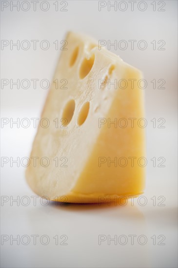 A piece of gruyere cheese.