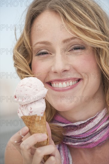 A woman eating ice cream.