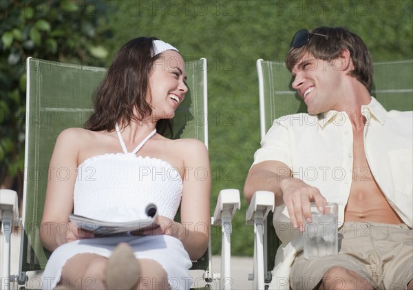 Couple relaxing outdoors.