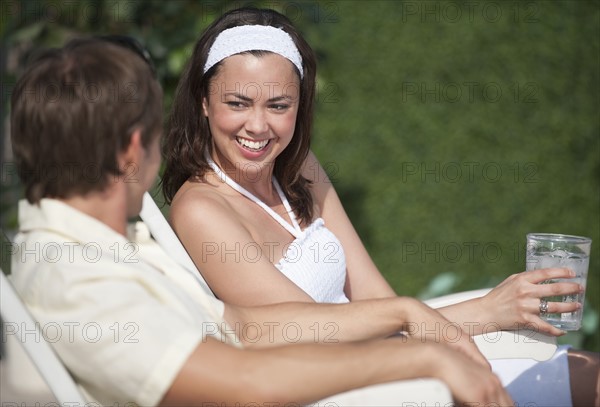 Couple relaxing outdoors.