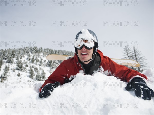 A snowboarder falling