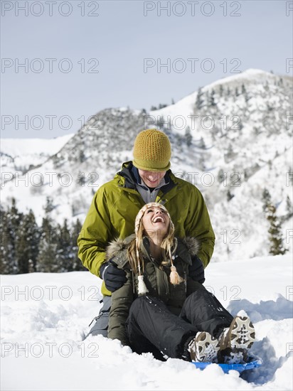 A couple sledding