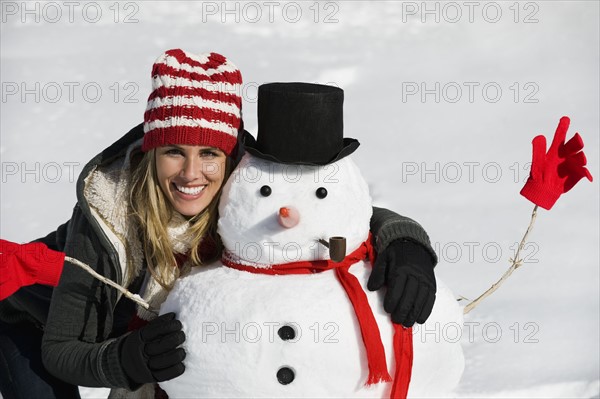A woman with a snowman