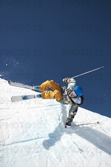 A downhill skier doing a trick