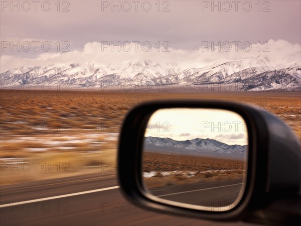 Side mirror shot from interior of car