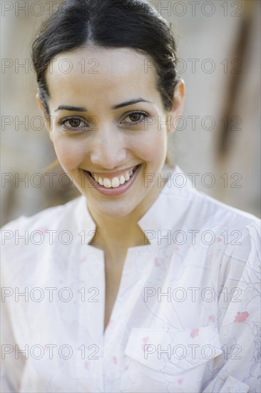 A woman outdoors smiling
