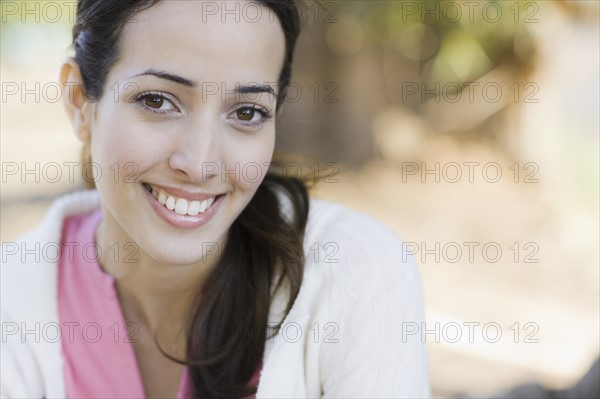 A woman outdoors smiling