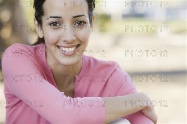 A woman outdoors smiling