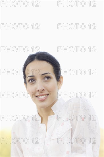 A woman outdoors smiling