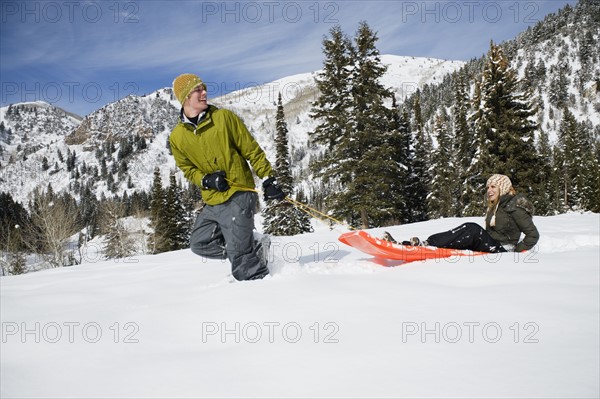 A couple sledding