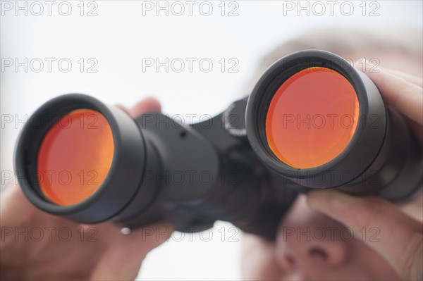 Man using binoculars.