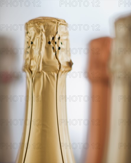 Four champagne bottles.