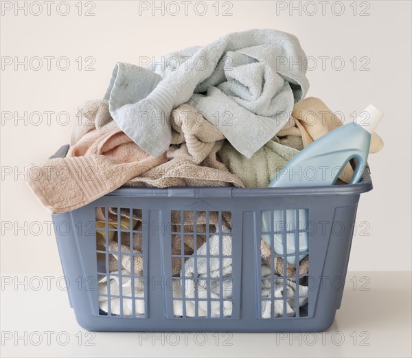 A laundry basket full of towels.