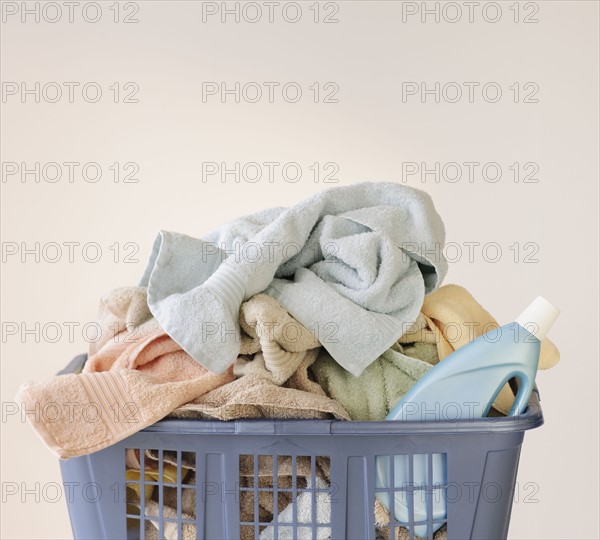 A laundry basket full of towels.