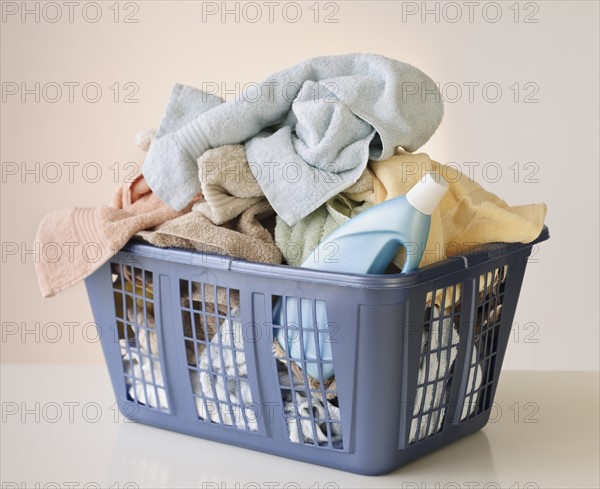 A laundry basket full of towels.