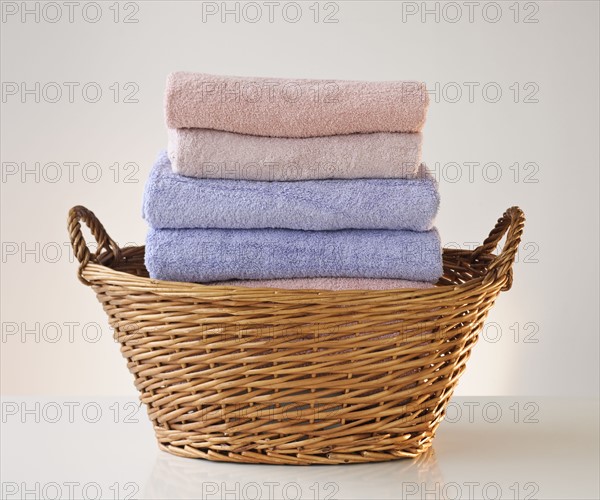 A laundry basket full of towels.