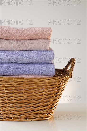 A laundry basket full of towels.