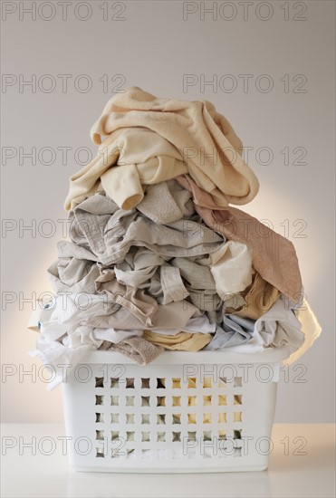 A laundry basket full of clothes.