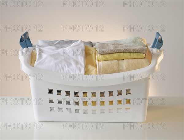 A laundry basket full of clothes.