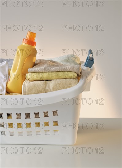 A laundry basket full of clothes.