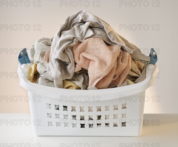 A laundry basket full of clothes.