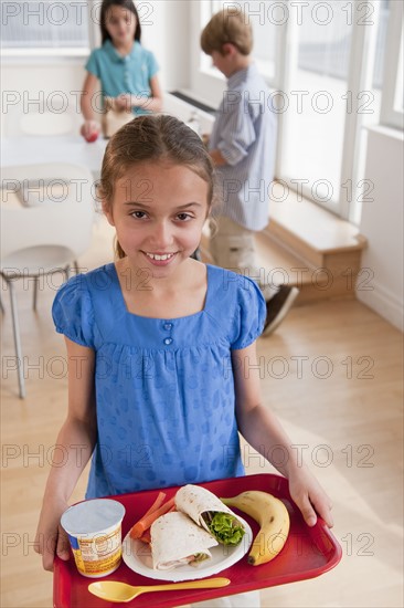 Kids in a cafeteria.