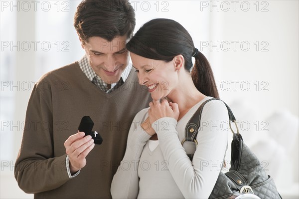 A couple looking at engagement rings.