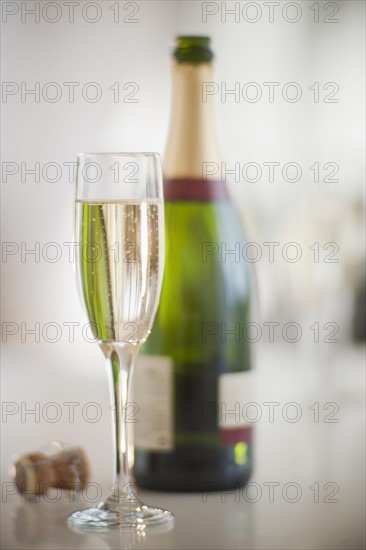 Champagne flute and bottle.