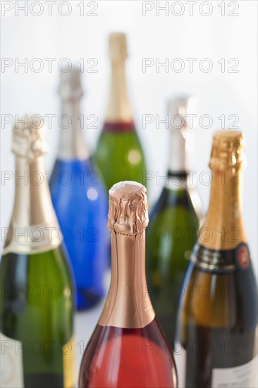 Six champagne bottles.