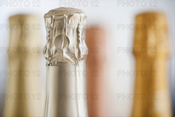 Four champagne bottles.