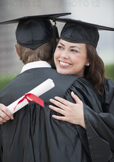 A young woman and young man graduating.