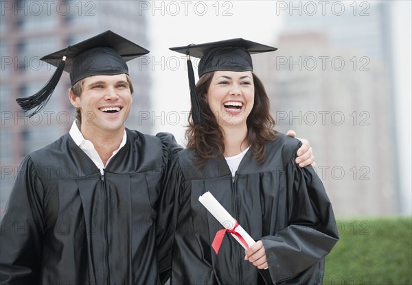 A young woman and young man graduating.