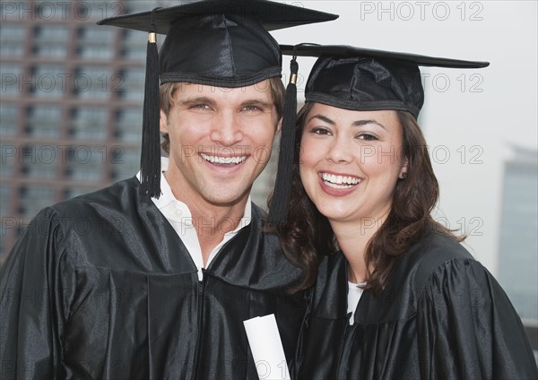 A young woman and young man graduating.