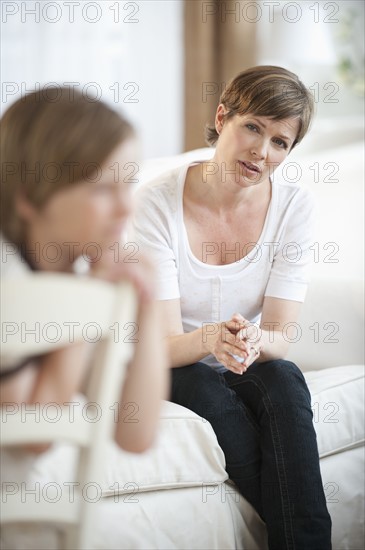 Mother talking with child.