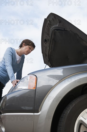 Woman shopping for car.