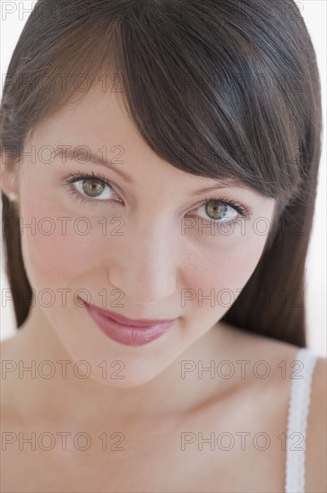 Woman looking into camera.