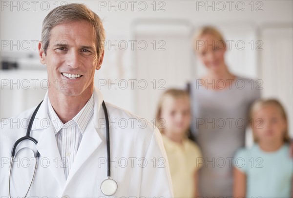 Mother and daughters at Doctor's office.