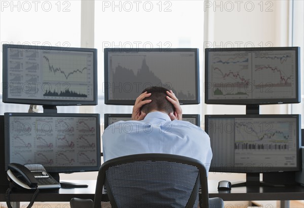 Frustrated male trader at work.