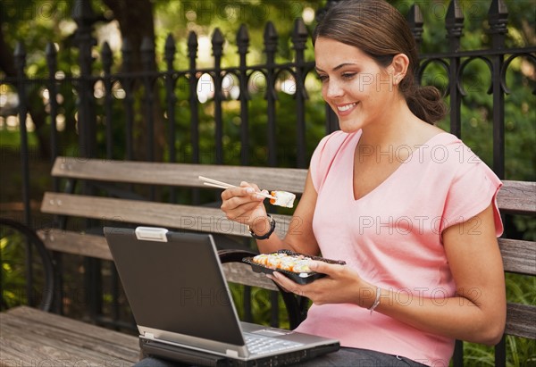 Woman eating Sushi