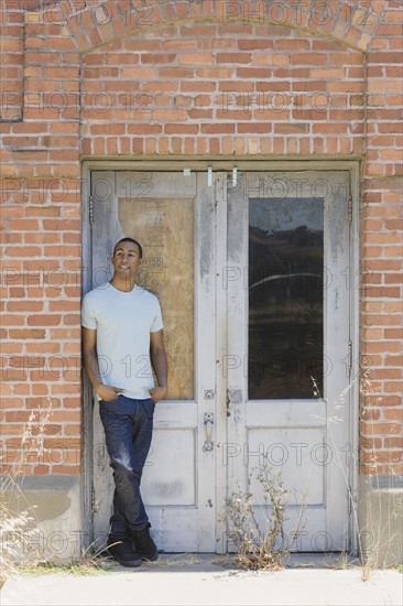 Young man at abandoned building