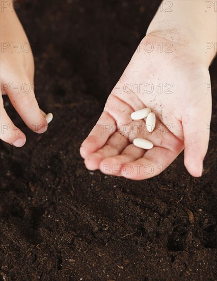 Child holding seeds