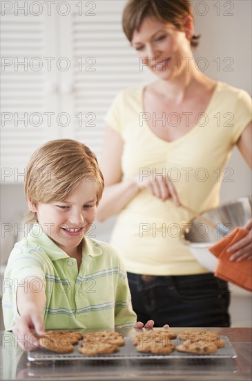 Mother and child baking