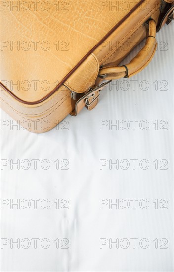 Suitcase on bed