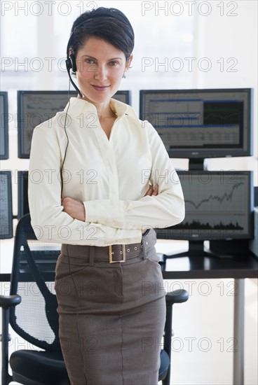 Female trader looking at camera.